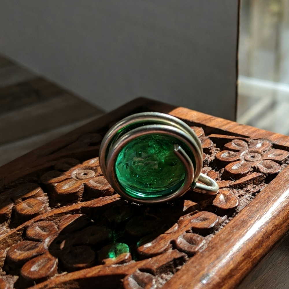 Silver pendant with green glass